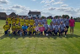 Harlee Breckon is pictured with footballers at the recent family fun day organised by William Hare Group in aid of Candlelighters.