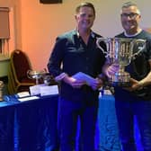Winner of the All England Codling Championship Adrian Colling receives the trophy from main match sponsor Phil France.
