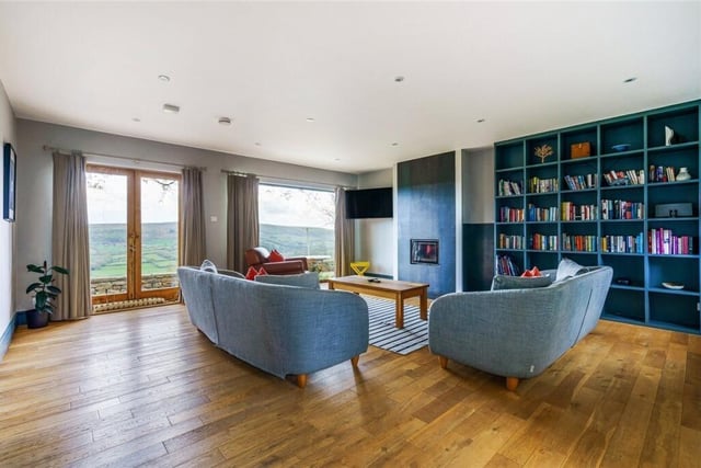 Large windows and glazed doors reveal miles of stunning scenery.