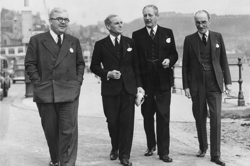 From left to right, British politician Charles Hill (1904 - 1989), Kenneth Pickthorn (1892 - 1975), Parliamentary Secretary to the Minister of Education, Harold Macmillan (1894 - 1986), the Minister of Housing, and Sir Geoffrey Hutchinson, 12th October 1952.