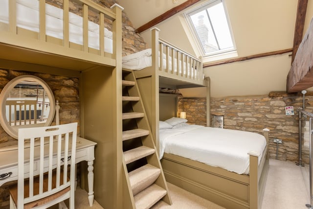 The barn annexe interior has both comfort and character, as with this mezzanine sleeping area.