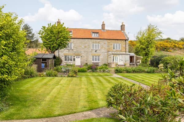The stunning 18th century farmhouse, with equally stunning gardens and views, is priced at £995,000