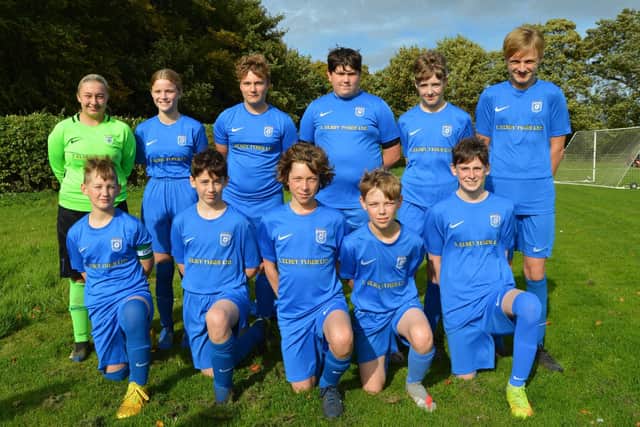 Heslerton Under 14's in their kit supplied by Terry Elsey Tyres of Malton.