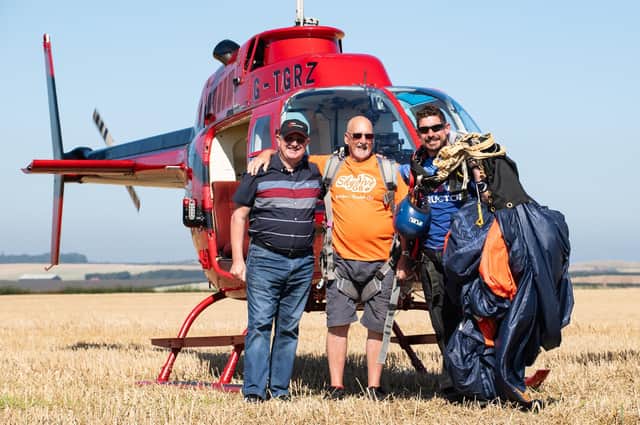 George Mattinson (center), together with Instructor Alec Flint (right) and Alan Ramsden of Tiger Helicopters (left). Photo: David Ruston