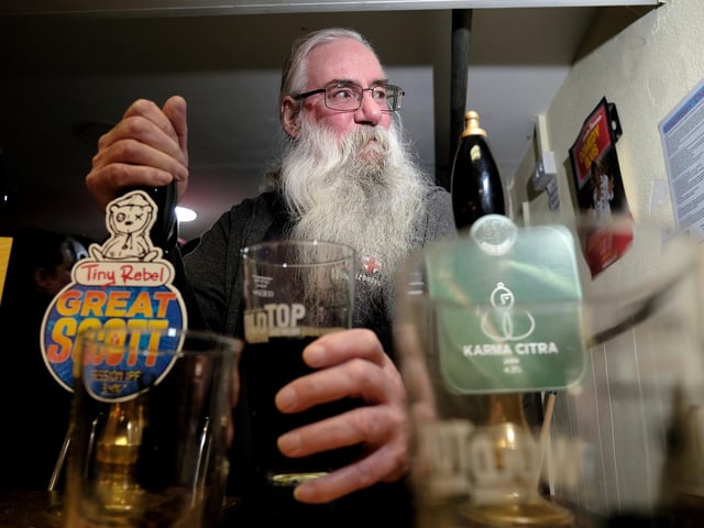 Dave pours a pint at the festival. picture: Richard Ponter