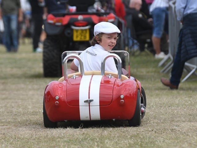 Luciano Lommando, aged 8, in his AC Cobra peddle car.