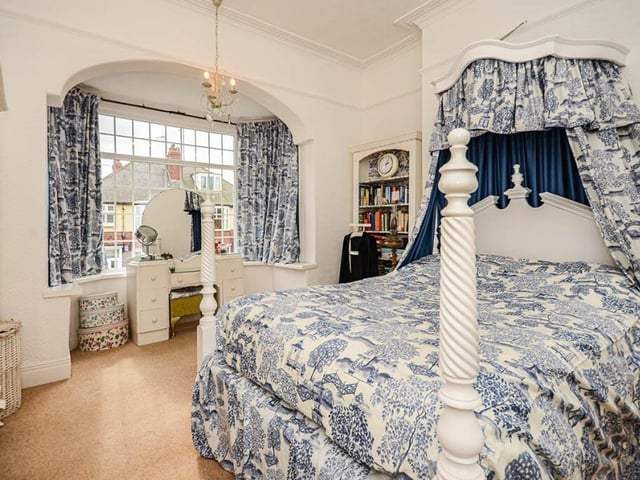 A stunning front bedroom with bay window.