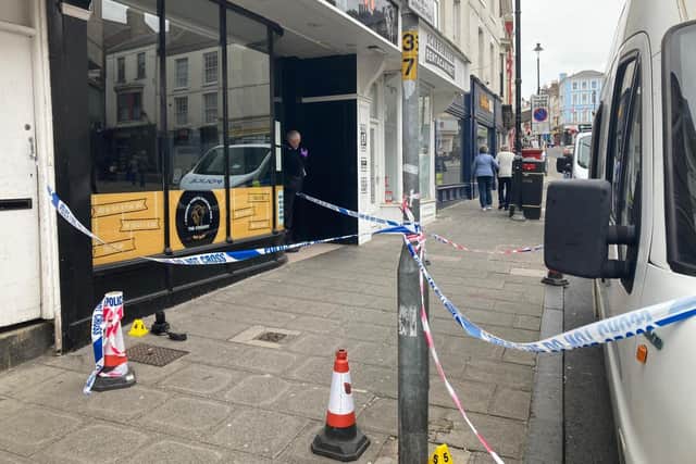 Forensic teams at the scene on Newborough where a man was attacked.