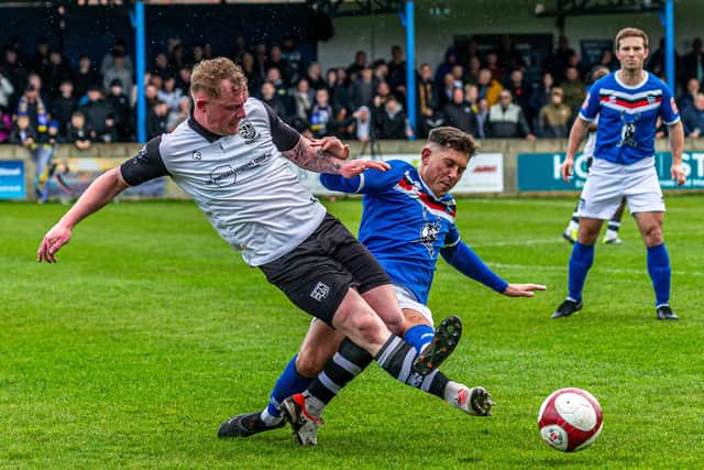 Whitby's Josef Wheatley tangles with Willam Tomlinson. PHOTO: BRIAN MURFIELD
