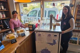 Off the Scale owner Lizzie Watson (L) was delighted to welcome Udderly Dale-icious's vending machine to her shop - pictured with Kim Johnson