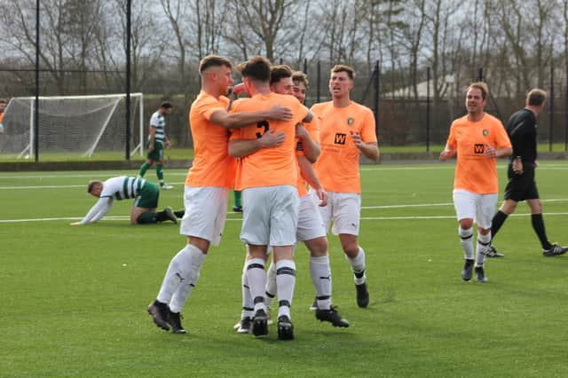 The Edgehill lads celebrate Joe Gallagher's goal in the NRCFA Saturday Challenge Cup win. PHOTO BY ALEC COULSON