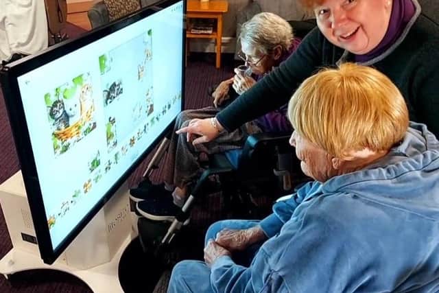 The Touch Pad can be moved easily for residents to enjoy in their own room.