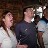 A close call for England as fans watch the game at the J and S Sports Bar.