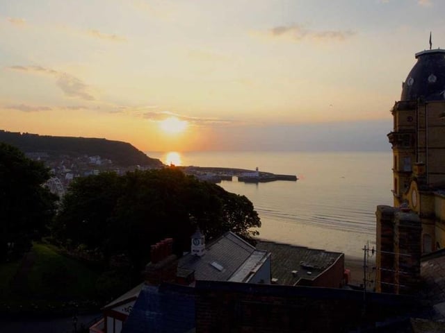 Looking out at the sunrise over the sea from the apartment.
