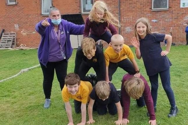 Creating their own pyramid provides a lot of laughs - and exercise too.