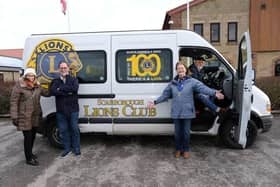 The Scarborough Lions by their iconic bus