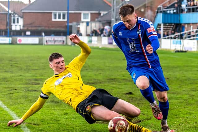 The Belper skipper tries to nick the ball away from Whitby Town's Aaron Haswell.