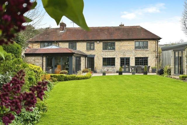 A view of the property from its landscaped gardens.