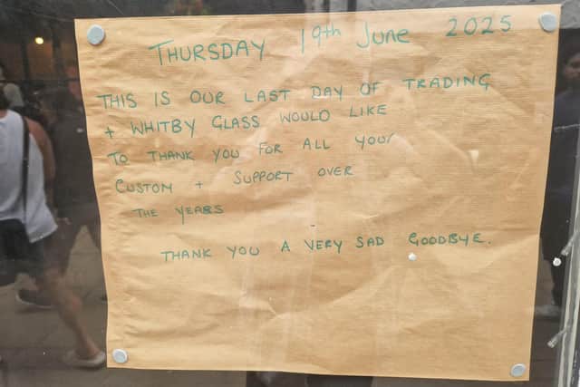 Sign in the window of Whitby Glass on its final day.