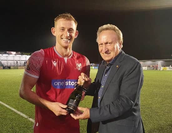 Legendary former Scarborough FC manager Neil Warnock hands over the man of the match award to Ash Jackson after Boro's 2-2 home draw with Bradford PA