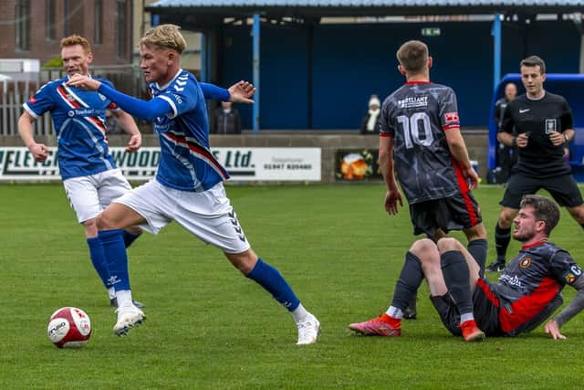 Harley Dawson's superb 25-yard lob earned Whitby a 1-0 win at leaders Warrington Rylands. Photo by Brian Murfield