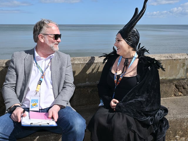 Chatting in the sea air.