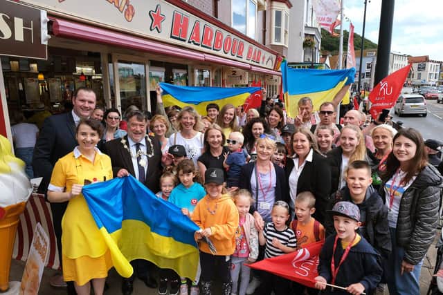 Ukrainian Mums and Children visit Scarborough with Mayor Eric Broadbent and Rotary Club president George Roberts greeting them at the Harbour Bar
