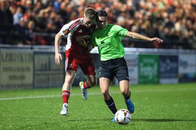 Harry Green battles it out with a Town player during the National League North clash. PHOTOS BY ZACH FORSTER