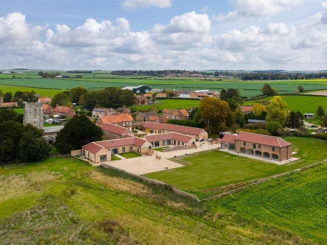 An aerial view of the property and its neighbours, in a lovely Wolds location.