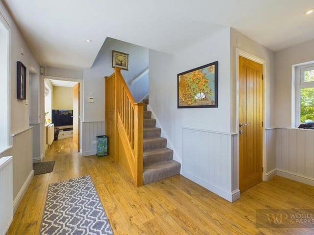 The hallway has an oak finish floor.