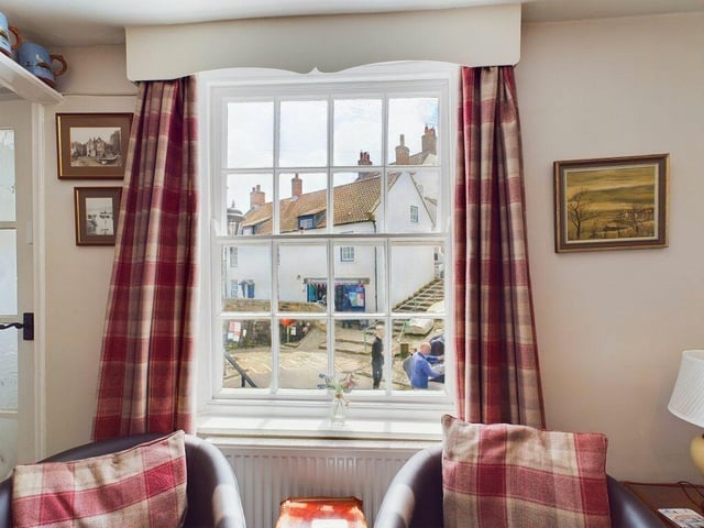 Village life outside the cottage windows.