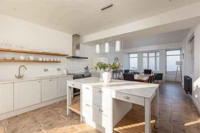 The bright, shaker style kitchen with dining room.