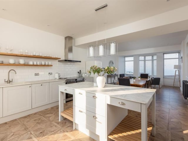 The bright, shaker style kitchen with dining room.