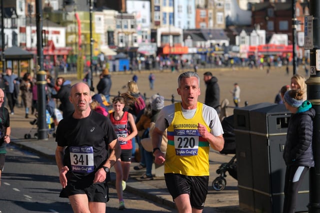 Scarborough AC's Adam Gosling, right, near the end of the 10k.    Photo by Richard Ponter