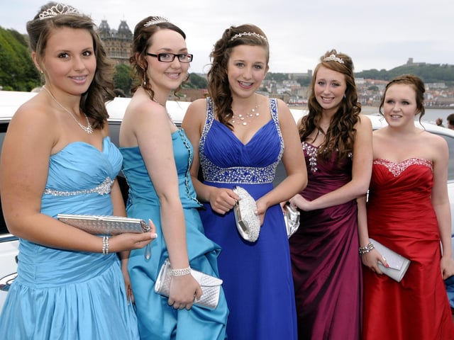 A procession of girls from Graham School take the red carpet from their limo.