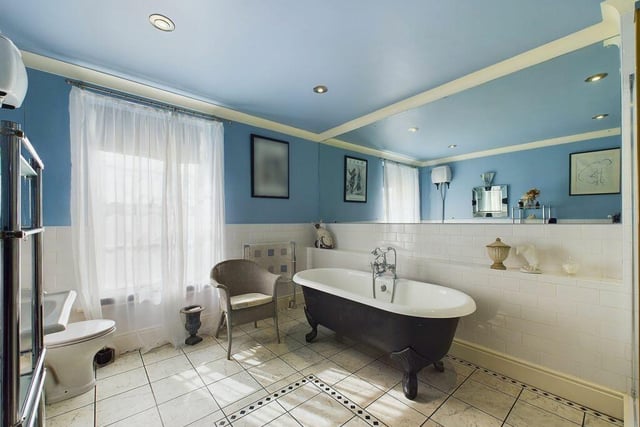 One of the property's bathrooms, with a free standing, roll top bath feature.