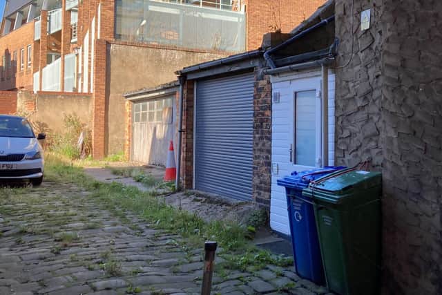 As part of the plans, the applicant must maintain access to and refurbish the overgrown cobbled street.