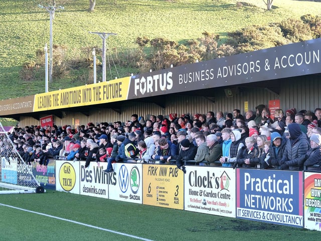 Scarborough Athletic supporters watch their team suffer a 5-2 loss against National League North leaders Darlington.