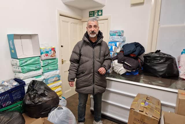 Mehmet Kaya with some of the items he has collected