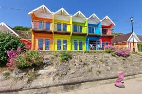 Brightly coloured beach chalets are up for grabs with price tags of £70,000 up.