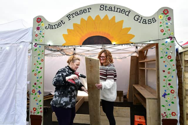 Setting up for Whitby's Christmas Festival ... getting Janet Fraser Stained Glass stall ready.
Pictured are Tracie Weatherill and Janet Fraser.