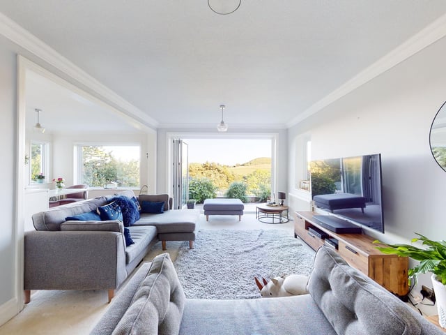 The lounge and entertainment space has bi-fold doors to its outdoor facilities.