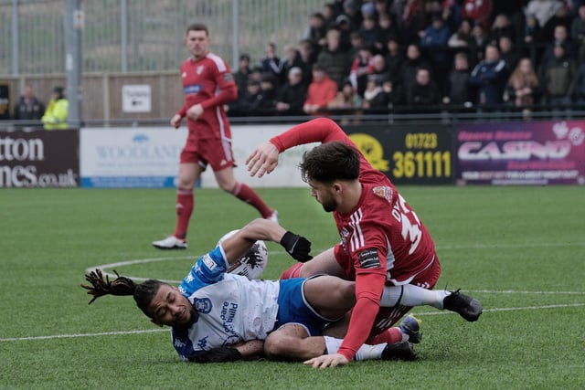 Boro midfielder Olly Dyson is tackled.