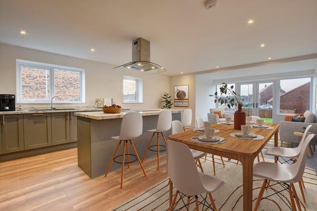 A bright, open plan kitchen with living and dining space.