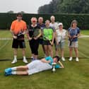 From left, Curtis Papworth, Jo Robinson, Steve Greenwood, Rosie Allan Lee's, Steve Mitchell, Sharon Havercroft, Carol Bickerdike, with Captain Joel Rollinson laid down with trophy.
