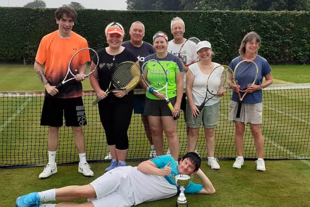 From left, Curtis Papworth, Jo Robinson, Steve Greenwood, Rosie Allan Lee's, Steve Mitchell, Sharon Havercroft, Carol Bickerdike, with Captain Joel Rollinson laid down with trophy.