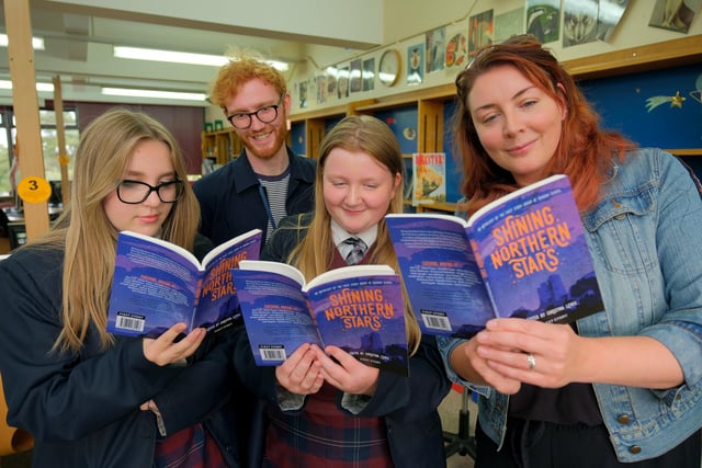 Reading with the pupils are Ali Johnson and Chrissie Lewis.