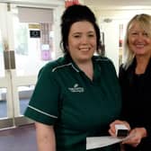Ebony Colman,Care Assistant, being presented her 10 year service award by Diane Peters, General Manager. Photo submitted.