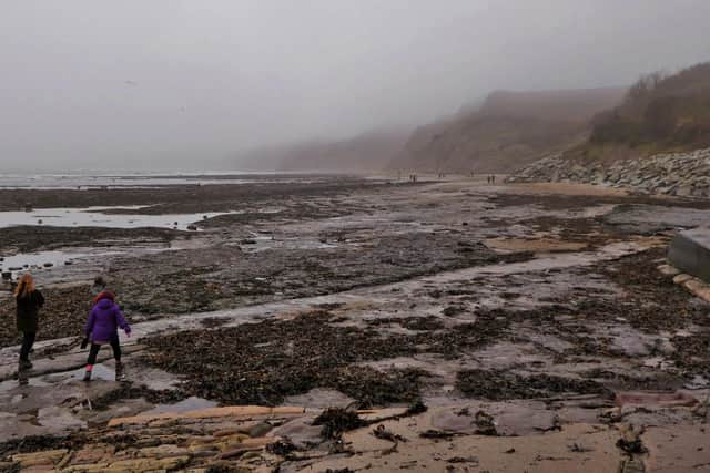 A misty beach scene at Robin Hood's Bay.