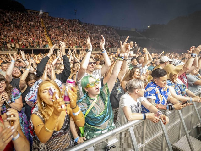 Happy fans cheering for the fantastic performance!